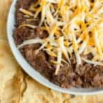 Refried beans made with black beans and ancho chilies. Great with nacho chips and cheddar cheese. Can also be made with pinto beans or red kidney beans.