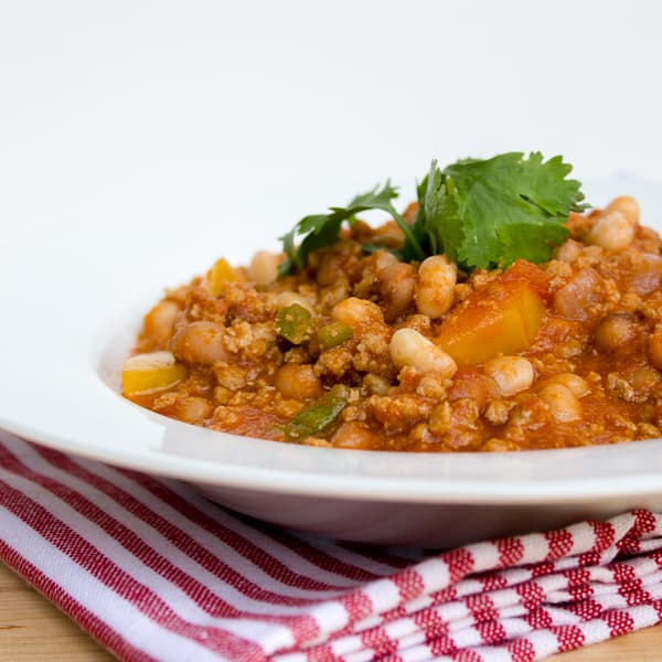 A smokey chili recipe made with ground pork, black eyed peas, yellow peppers and jalapenos. Chipotle powder and smoked paprika provide a deep smokey flavour.