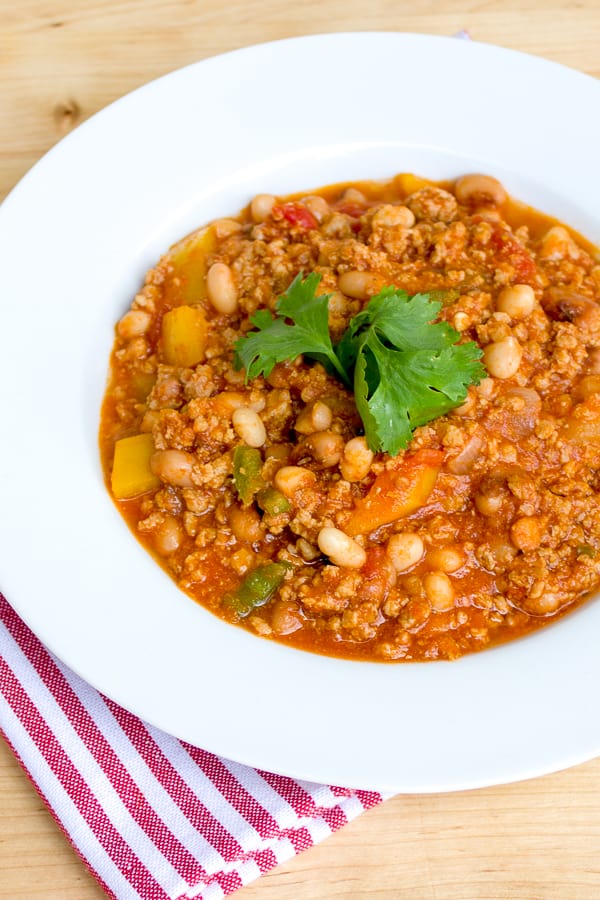 A smokey chili recipe made with ground pork, black eyed peas, yellow peppers and jalapenos. Chipotle powder and smoked paprika provide a deep smokey flavour.