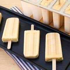 Mango Lassi Popsicle. Frozen Mango smoothie with mango puree, yogurt, milk, honey and cardamom.