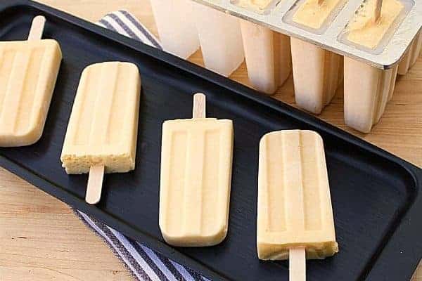 Mango Lassi Popsicle. Frozen Mango smoothie with mango puree, yogurt, milk, honey and cardamom.