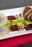 Duck Breast and Cognac Duxelle Wonton Ravioli Recipe with Pomegranate Cognac Sauce and Basil Pesto.