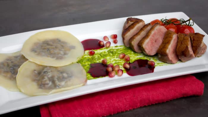 Duck Breast and Cognac Duxelle Wonton Ravioli Recipe with Pomegranate Cognac Sauce and Basil Pesto.