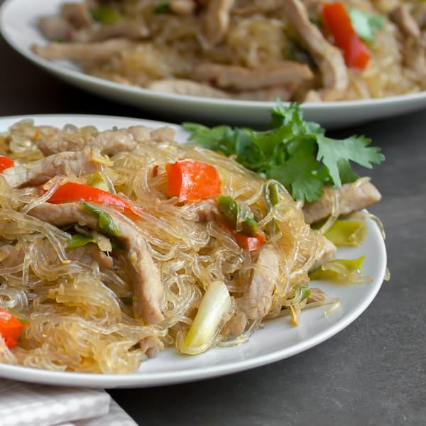 A Thai inspired dish with pork, red peppers and green onions/scallions and glass noodles. Also known as crystal noodles, cellophane noodles or Chinese noodles, these are made with bean or peas.