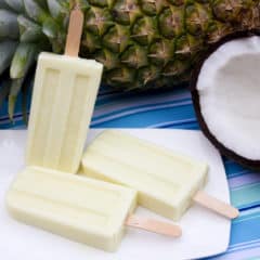 Pina Colada Creamsicle with fresh pineapple, coconut milk, and rum extract. This popsicle is the perfect cool treat on a hot summer day!