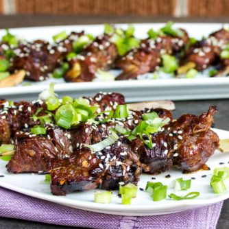 Grilled beef tenderloin skewers marinated in an Asian sesame marinade. Sesame oil, soy sauce, ginger, garlic and green onions.