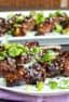 Grilled beef tenderloin skewers marinated in an Asian sesame marinade. Sesame oil, soy sauce, ginger, garlic and green onions.