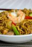 Easy to make classic Chinese stir fried noodles. This chow mein has pork and shrimp along with peppers, celery, green onions and more.
