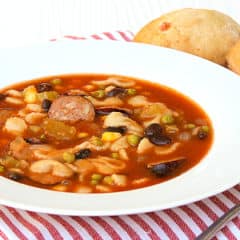 Minestrone soup recipe made with smoked sausage, andouille or kielbasa. Black beans, corn, peas and pasta noodles in the soup with a tomato based broth.