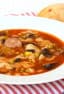 Minestrone soup recipe made with smoked sausage, andouille or kielbasa. Black beans, corn, peas and pasta noodles in the soup with a tomato based broth.