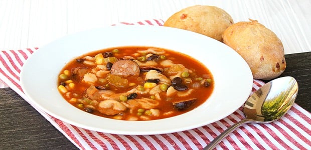 Minestrone soup recipe made with smoked sausage, andouille or kielbasa. Black beans, corn, peas and pasta noodles in the soup with a tomato based broth.