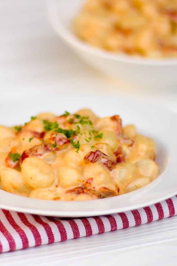 A simple cream sauce for potato gnocchi that can easily be made on a weeknight after work. The sun dried tomatoes give great flavour and the parmesan cheese and cream make the sauce silky smooth.