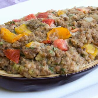 Hollowed out eggplant filled with stuffing.