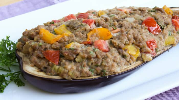 Hollowed out eggplant filled with stuffing.