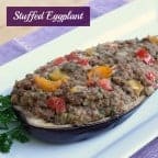 Stuffed eggplant recipe with ground beef, ground pork, peppers, onions and tomatoes. This is oven baked and the perfect as a main entree or side dish.