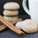 Cookies next to cinnamon sticks.