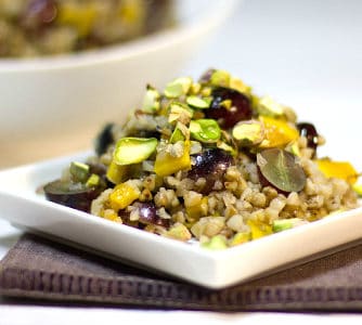 A gluten free salad made with kasha (roasted buckwheat), grapes, dried mango, pistachios and a honey lime dressing.