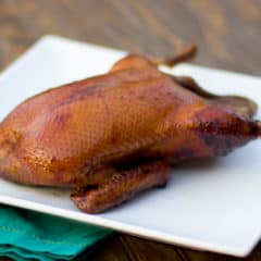 Smoked whole duck with a honey balsamic glaze with mesquite or hickory wood.