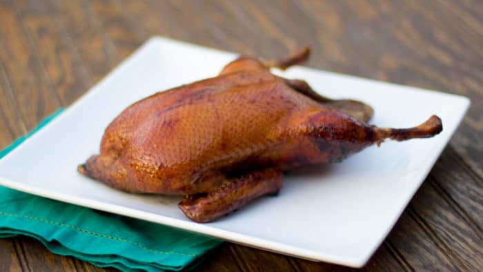 Smoked whole duck with a honey balsamic glaze with mesquite or hickory wood.
