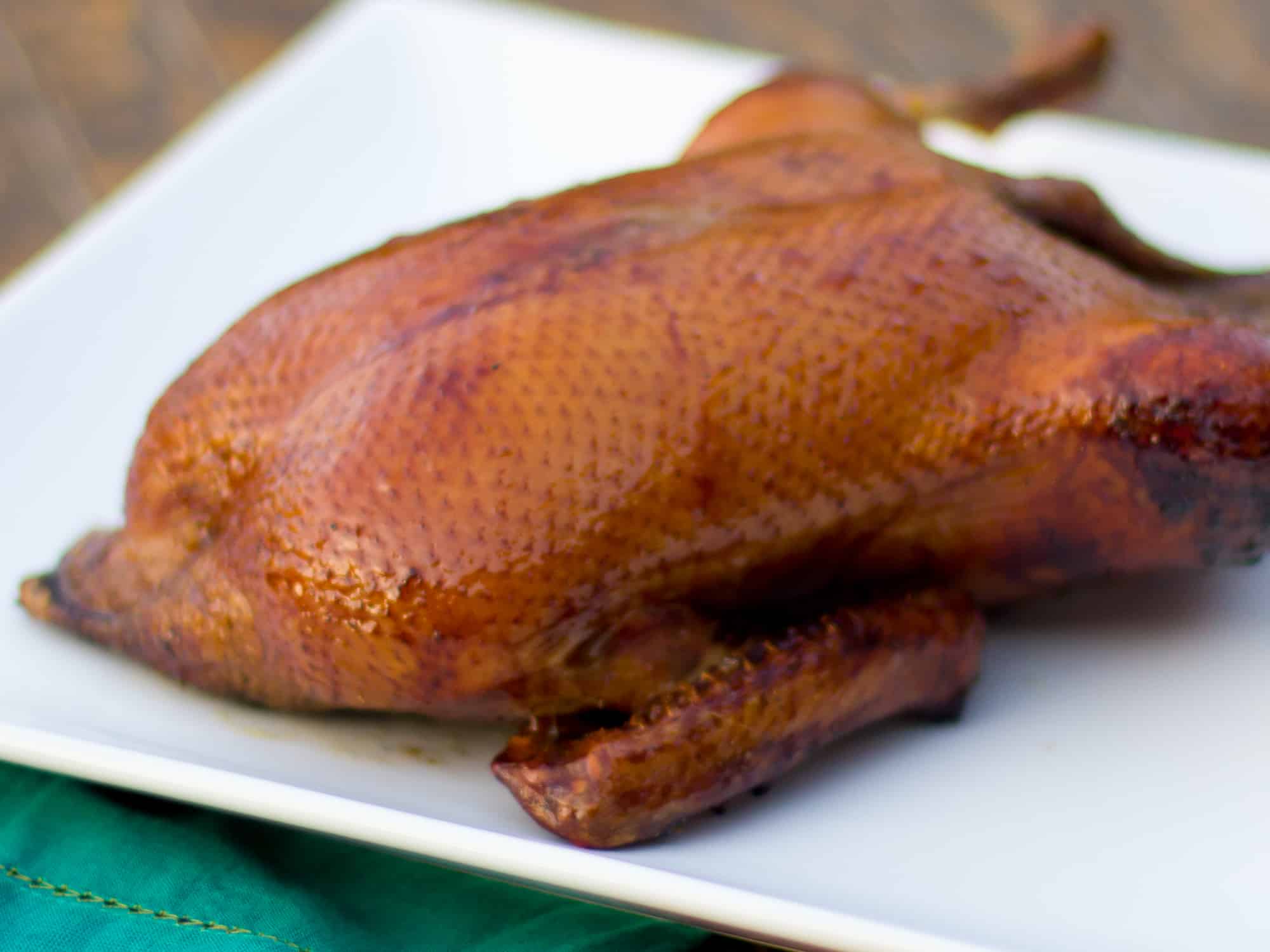 Smoked whole duck with a honey balsamic glaze with mesquite or hickory wood. 