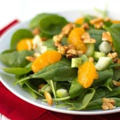 This bright and fresh salad recipe is filled with spinach, celery, green onions, mandarin oranges and candied almonds.