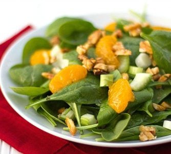 This bright and fresh salad recipe is filled with spinach, celery, green onions, mandarin oranges and candied almonds.