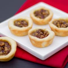 Maple syrup and pecans make up the filling in these mini tarts tassies that are simple and delicious. Cream cheese and butter pastry.