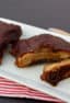 Slow braised ribs with rub and bourbon bbq sauce recipe. Cook in the oven or crock pot / slow cooker. Meat is fall off the bone tender.