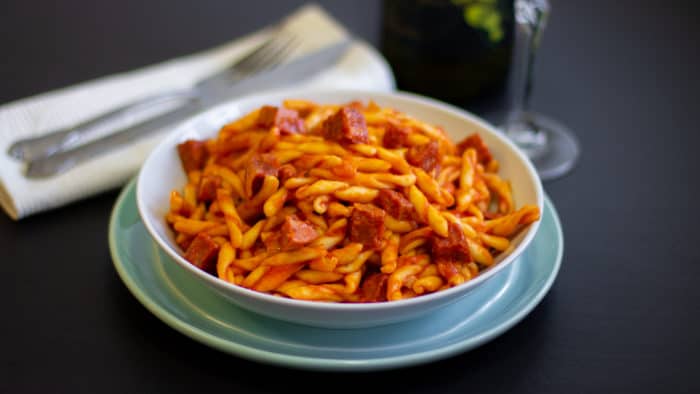 Rustic Italian pasta sauce recipe made with pancetta, mortadella and soppressata salami. Fresh tomatoes, basil, onion and peppers sweeten the sauce.