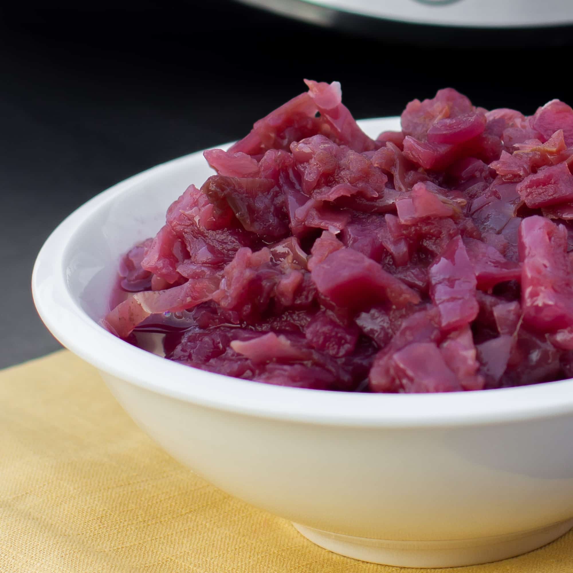 Slow braised red cabbage and apples this German side dish is perfect for the crock pot. Red cabbage, apples, vinegar, onion, sugar. Classic slow cooker recipe.