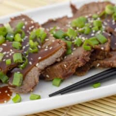 Simple slow cooker recipe for how to cook a beef roast in a crock pot. Boneless ribeye roast with a sweet Asian sesame marinade. Serve on rice with stir fried vegetables.