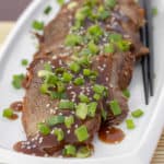 Simple slow cooker recipe for how to cook a beef roast in a crock pot. Boneless ribeye roast with a sweet Asian sesame marinade. Serve on rice with stir fried vegetables.