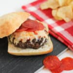 A homemade burger with pepperoni pizza toppings