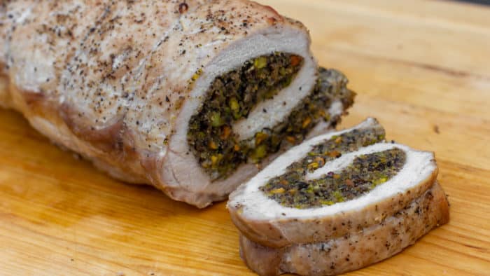 A butterflied boneless pork loin stuffed with duxelles type stuffing with sauteed mushrooms, shallots, pistachios, parmesan cheese and fresh oregano. How to instructions to butterfly a pork loin.