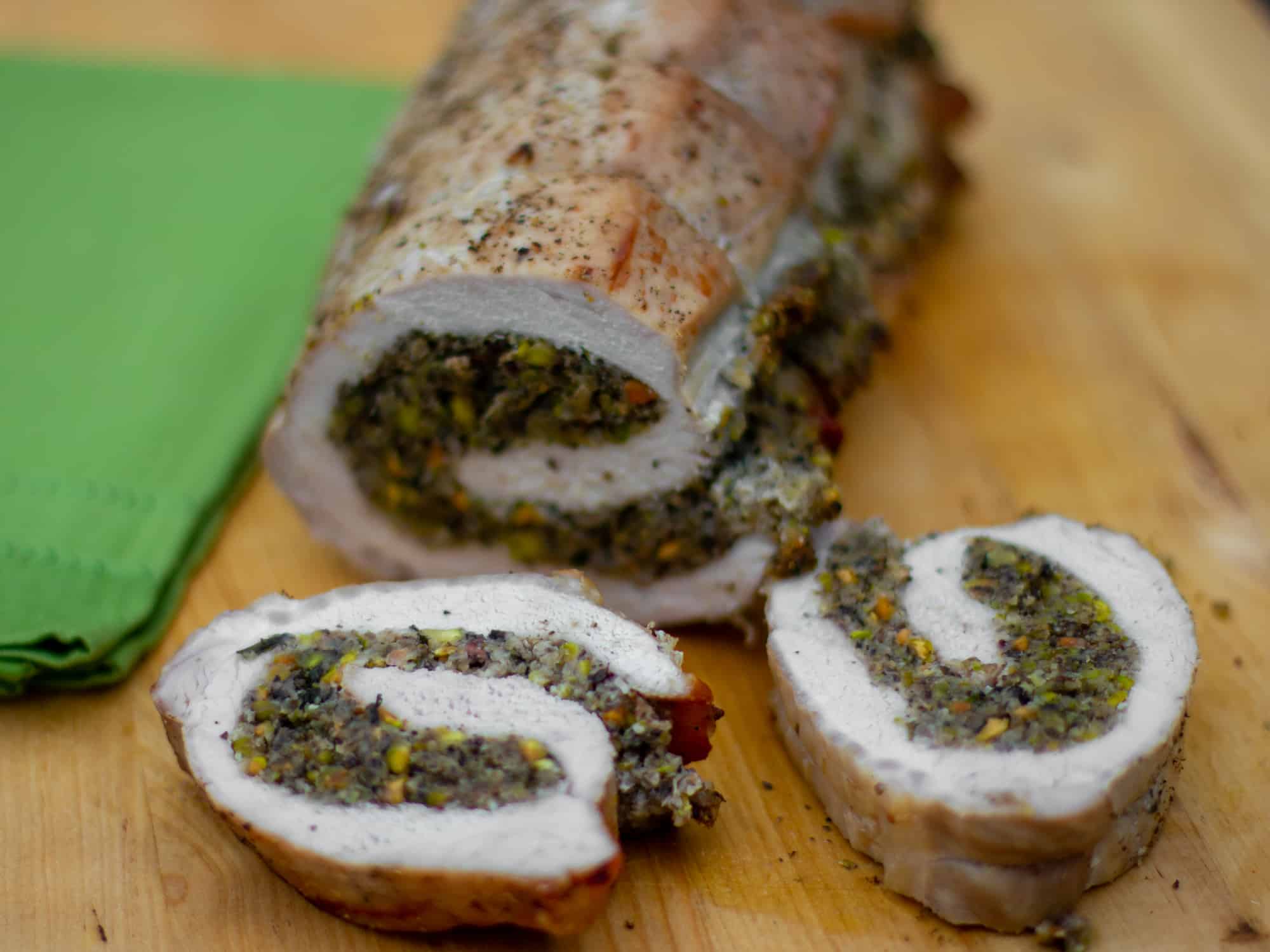 A butterflied boneless pork loin stuffed with duxelles type stuffing with sauteed mushrooms, shallots, pistachios, parmesan cheese and fresh oregano. How to instructions to butterfly a pork loin.