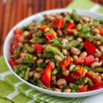 A bright and fresh Mexican salad made with nopalito cactus, black eyed peas, red pepper, green onions, cilantro, lemon juice and olive oil.