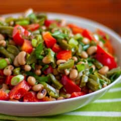 A bowl of Mexican inspired salad with prickly pear cactus and black eyed peas