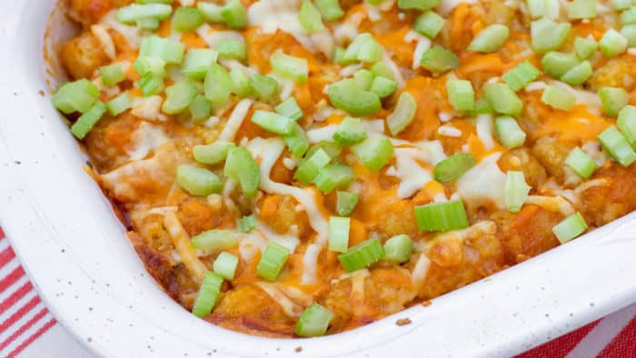 Great pub food and \ comfort food combined. Buffalo chicken with blue cheese covered with Tater Tots and grated cheese. Baked and then topped with celery before serving.