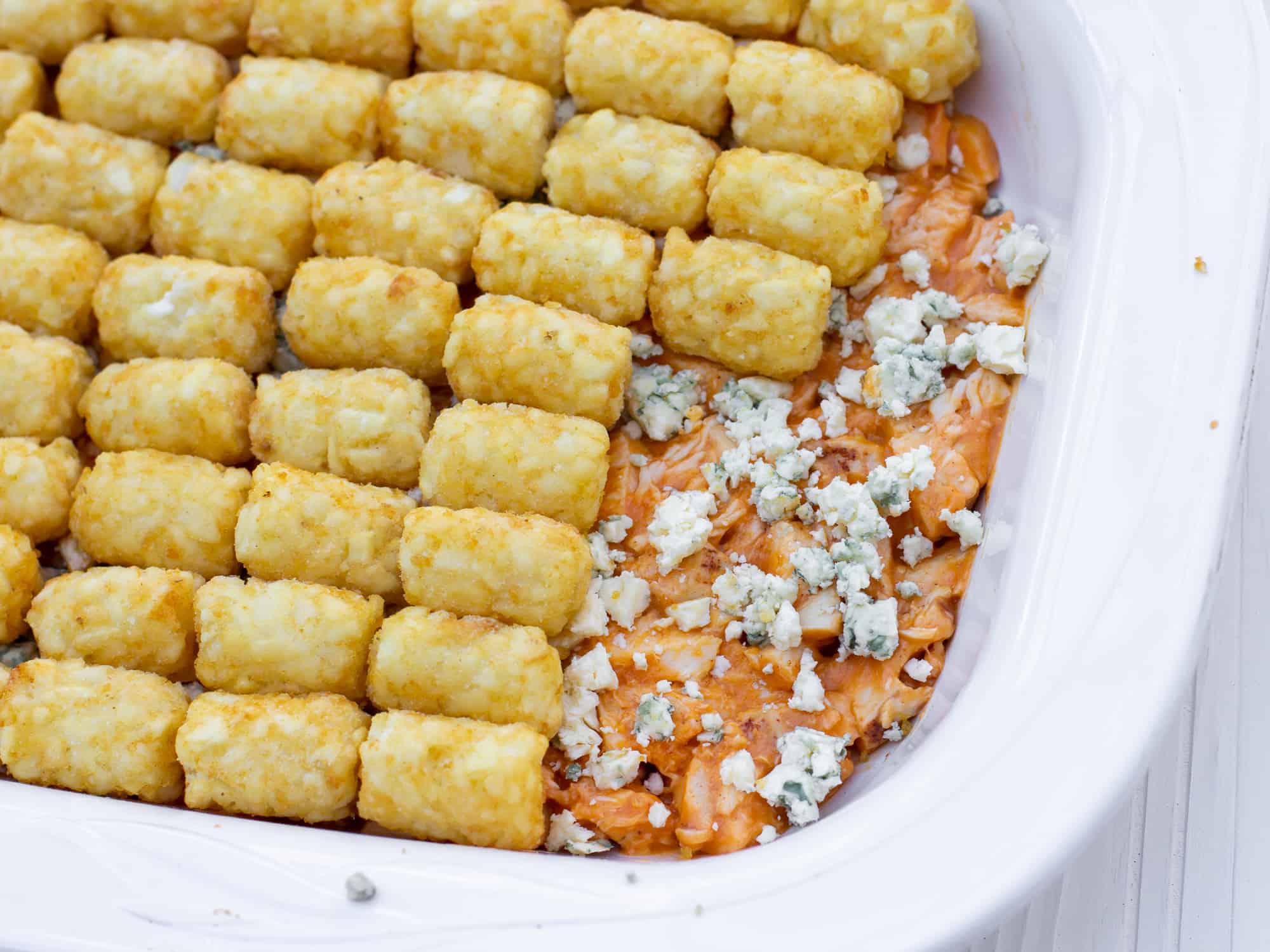 Spread the buffalo chicken filling with blue cheese