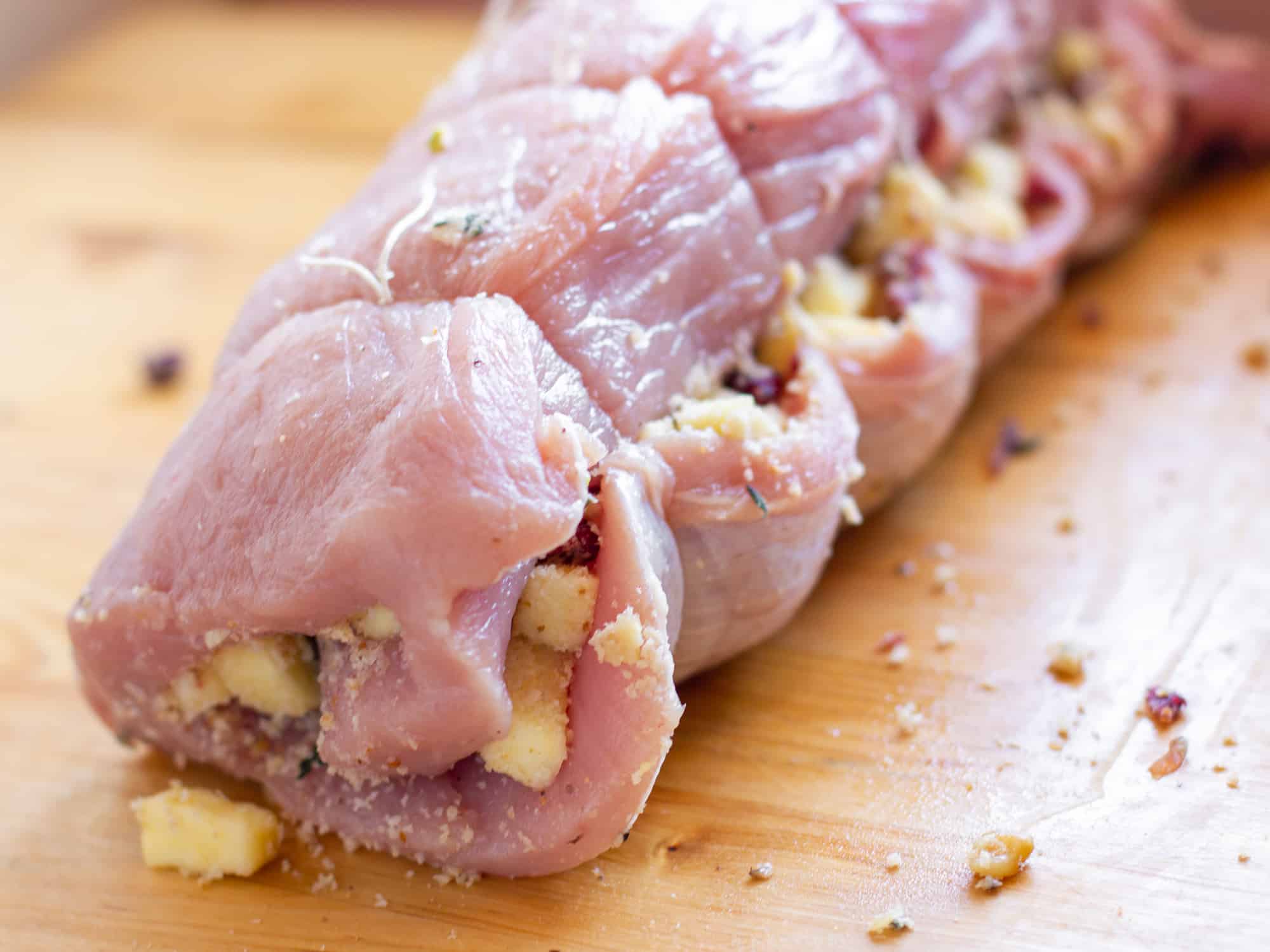 Tie up the rolled pork loin with kitchen twine.