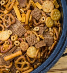 Make Bits and Bites mix at home with this simple recipe. Shreddies, Cheerios, Cheese Bits, Ritz, Pretzels, Chex and mixed with butter, worchestershire sauce, tabasco and spices