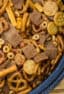 Make Bits and Bites mix at home with this simple recipe. Shreddies, Cheerios, Cheese Bits, Ritz, Pretzels, Chex and mixed with butter, worchestershire sauce, tabasco and spices