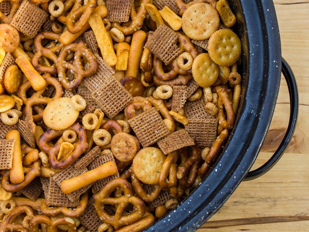 Make Bits and Bites mix at home with this simple recipe. Shreddies, Cheerios, Cheese Bits, Ritz, Pretzels, Chex and mixed with butter, worchestershire sauce, tabasco and spices