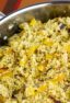 Overhead picture of a saucepan with cooked couscous.