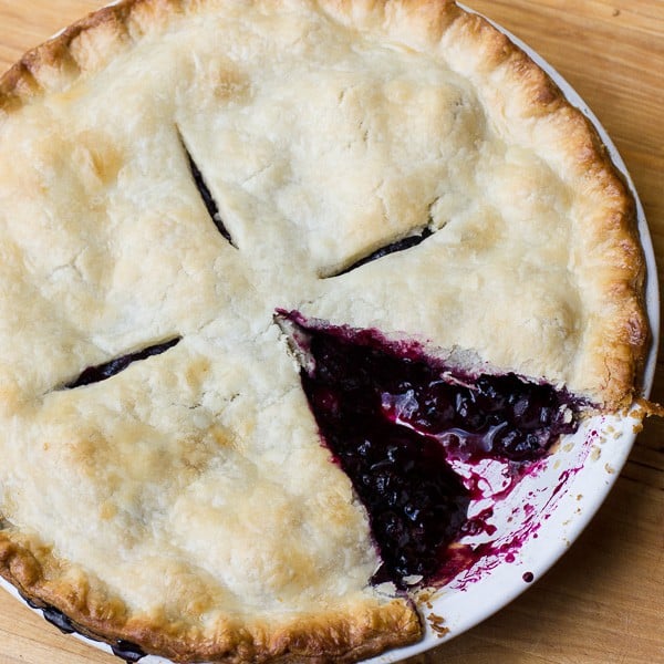 Traditional country pie pastry made with lard and a filling made of fresh blueberries, sugar, tapioca and lemon juice. Flaky, tender and delicious. Easy instructions for how to make this homemade pie.