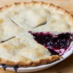 Traditional country pie pastry made with lard and a filling made of fresh blueberries, sugar, tapioca and lemon juice. Flaky, tender and delicious. Easy instructions for how to make this homemade pie.