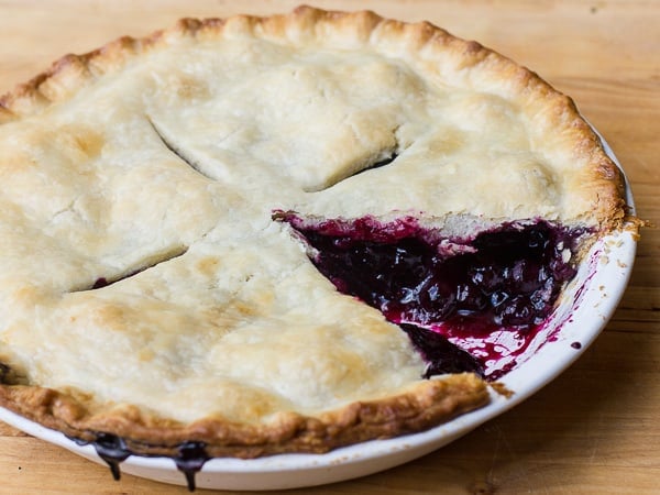 Traditional country pie pastry made with lard and a filling made of fresh blueberries, sugar, tapioca and lemon juice. Flaky, tender and delicious. Easy instructions for how to make this homemade pie.