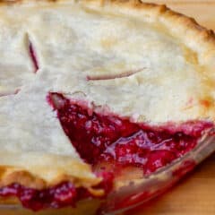 Fresh baked fruit pie with a slice removed