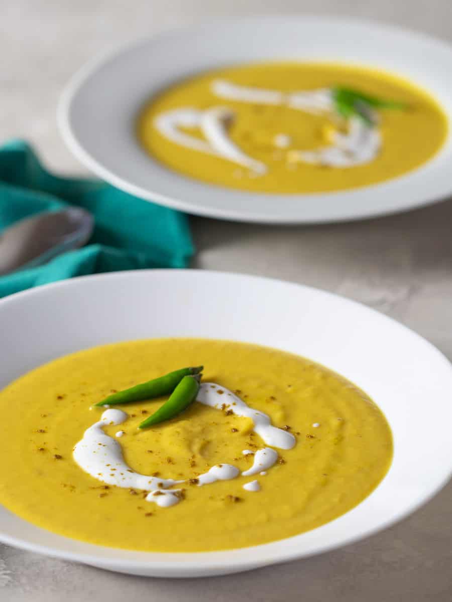 An overhead picture of two bowls of squash soup.