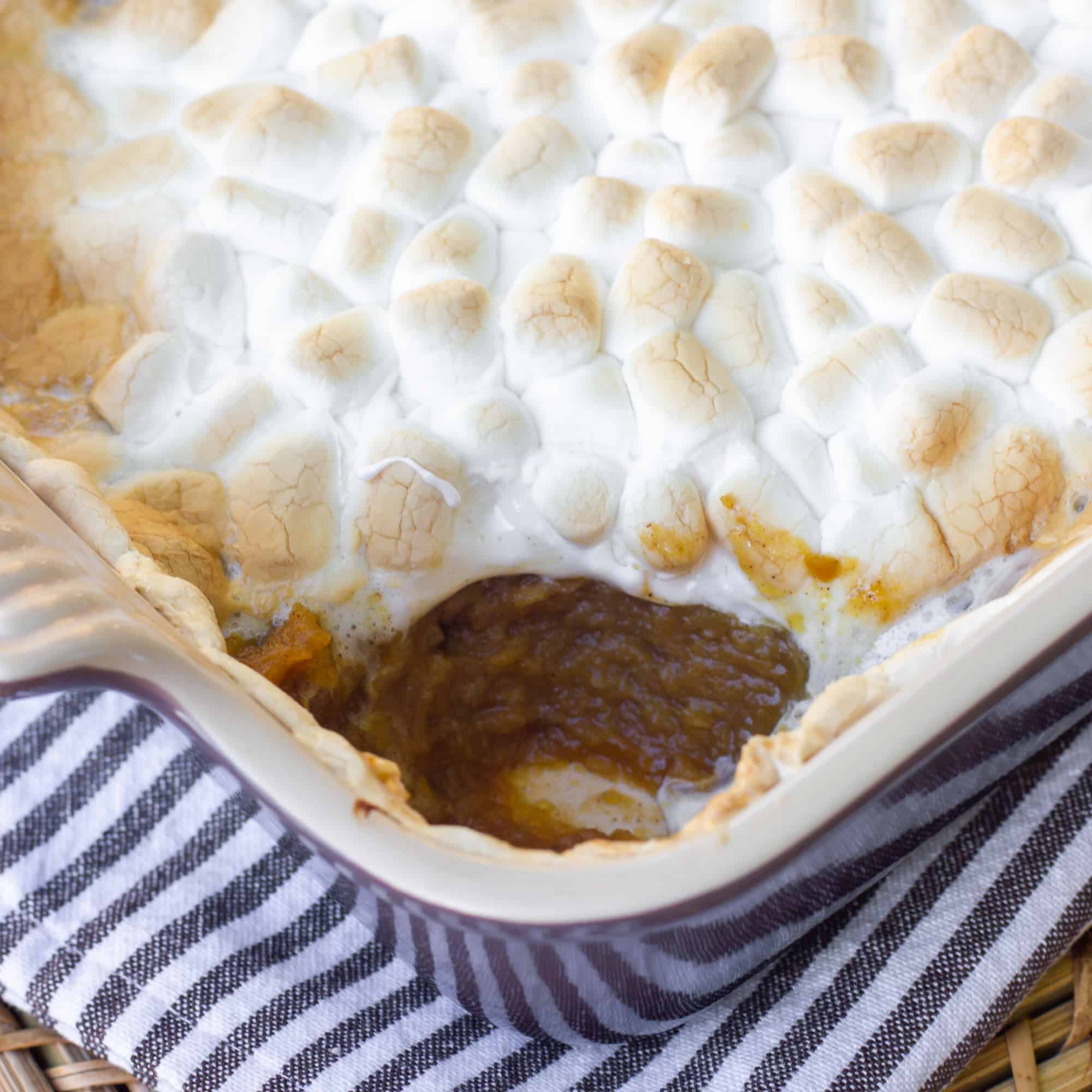 Close up image of pumpkin pie casserole with toasted marshmallows